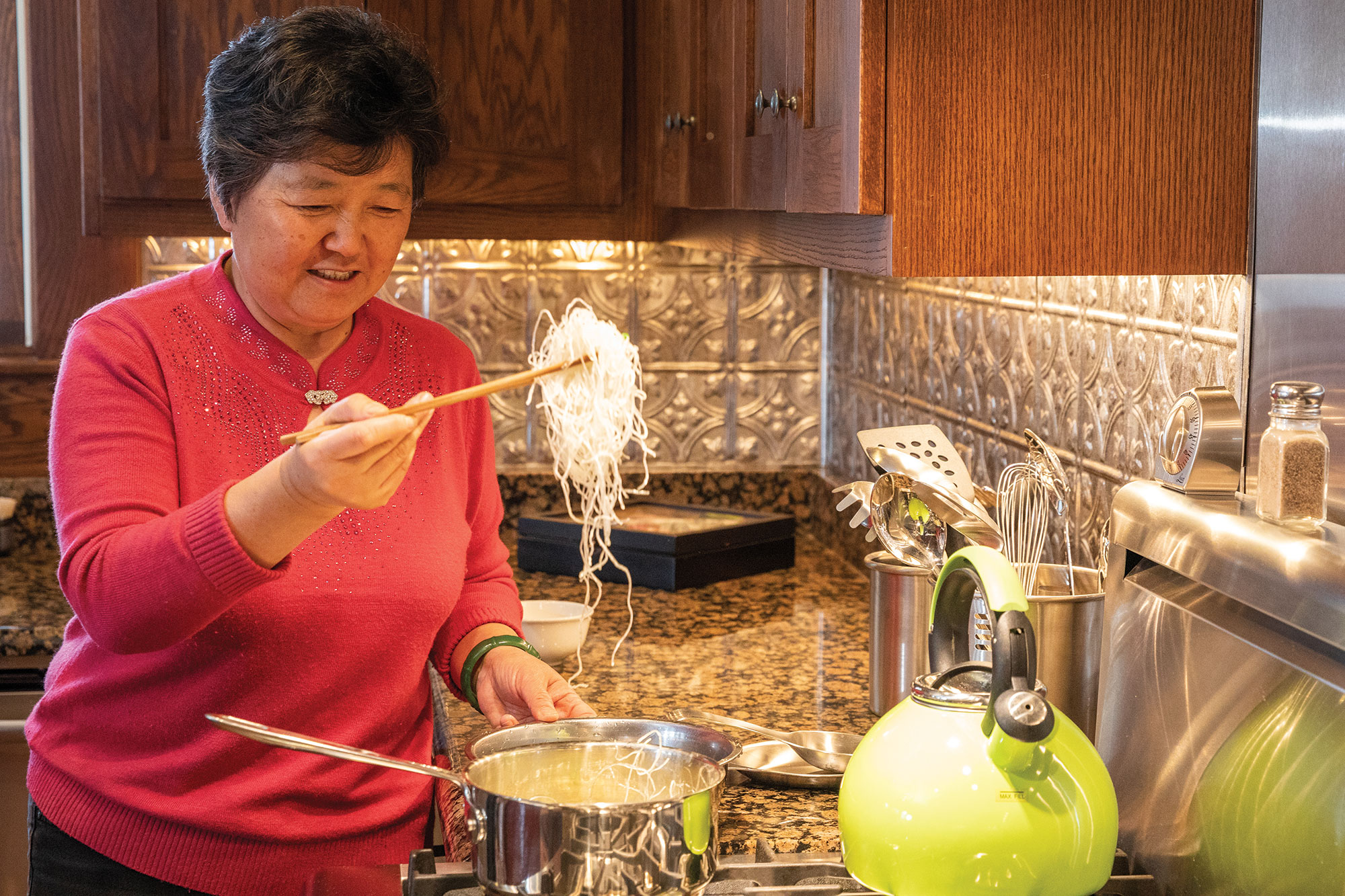Yaxin Ge makes egg rolls