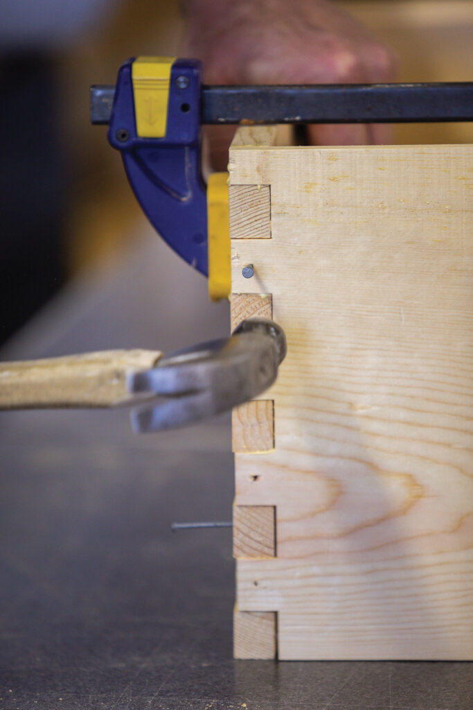 Nailing corner joints together.