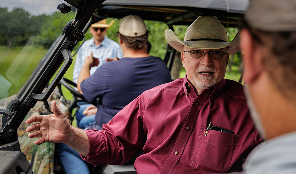 ranchers talking in pasture
